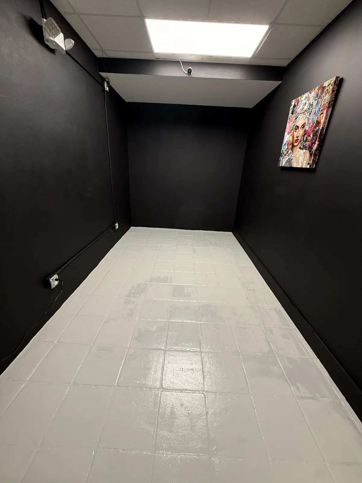 Black walls with high-traffic floor coating in a Miami commercial space
