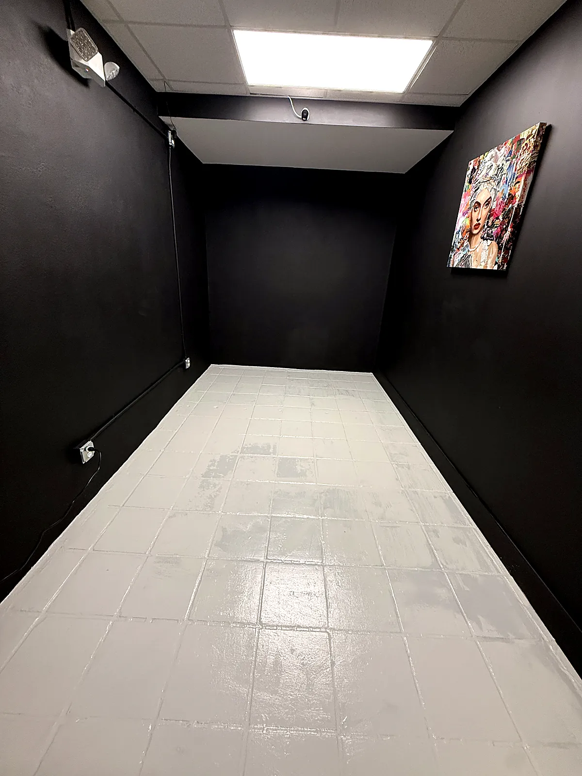 Commercial hallway with black painted walls and grey high-traffic floor coating in Miami