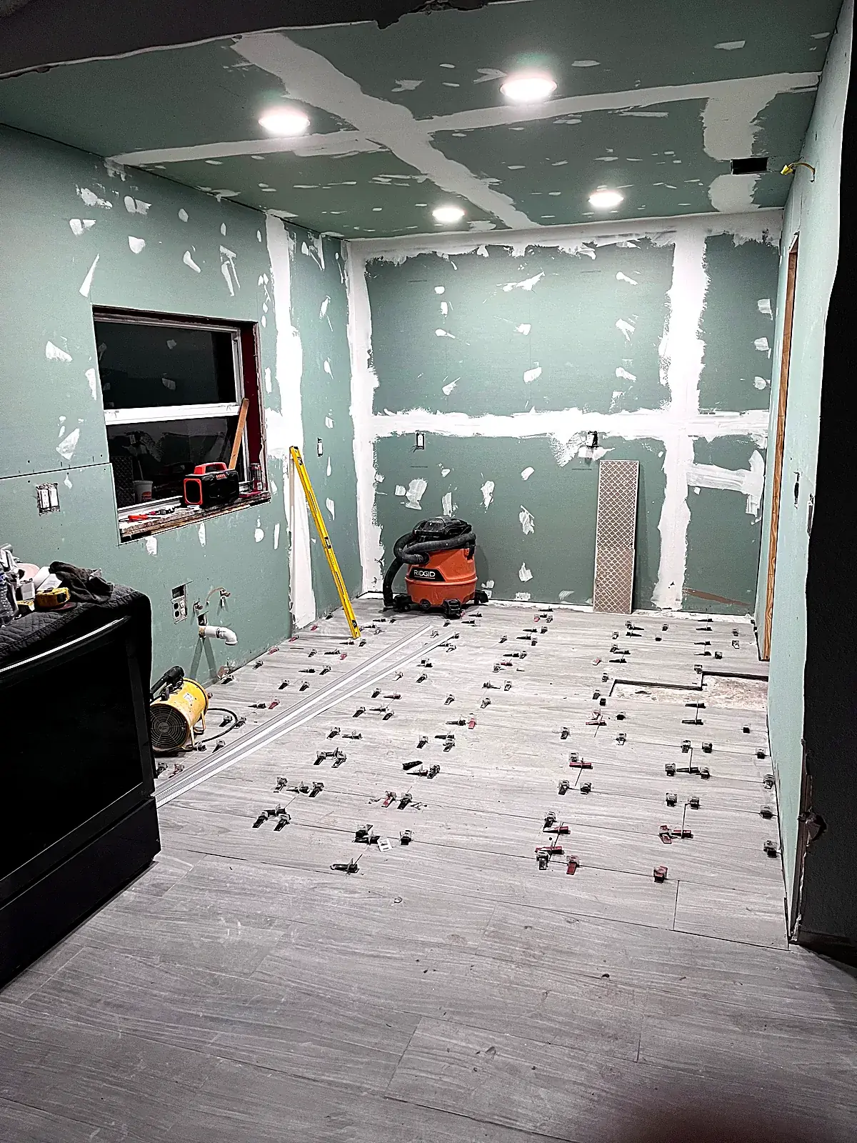 Kitchen stripped to drywall before the refresh in Miami