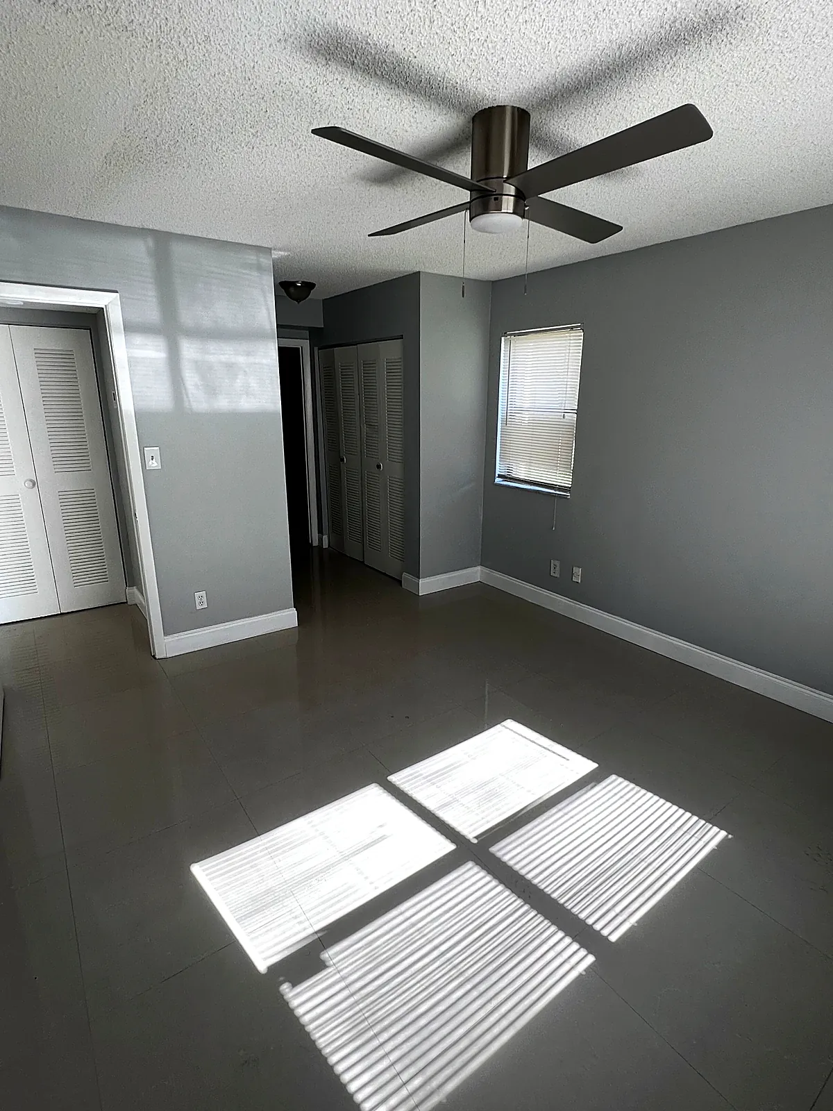 Bedroom repainted in grey with white trim and ceiling in Miami